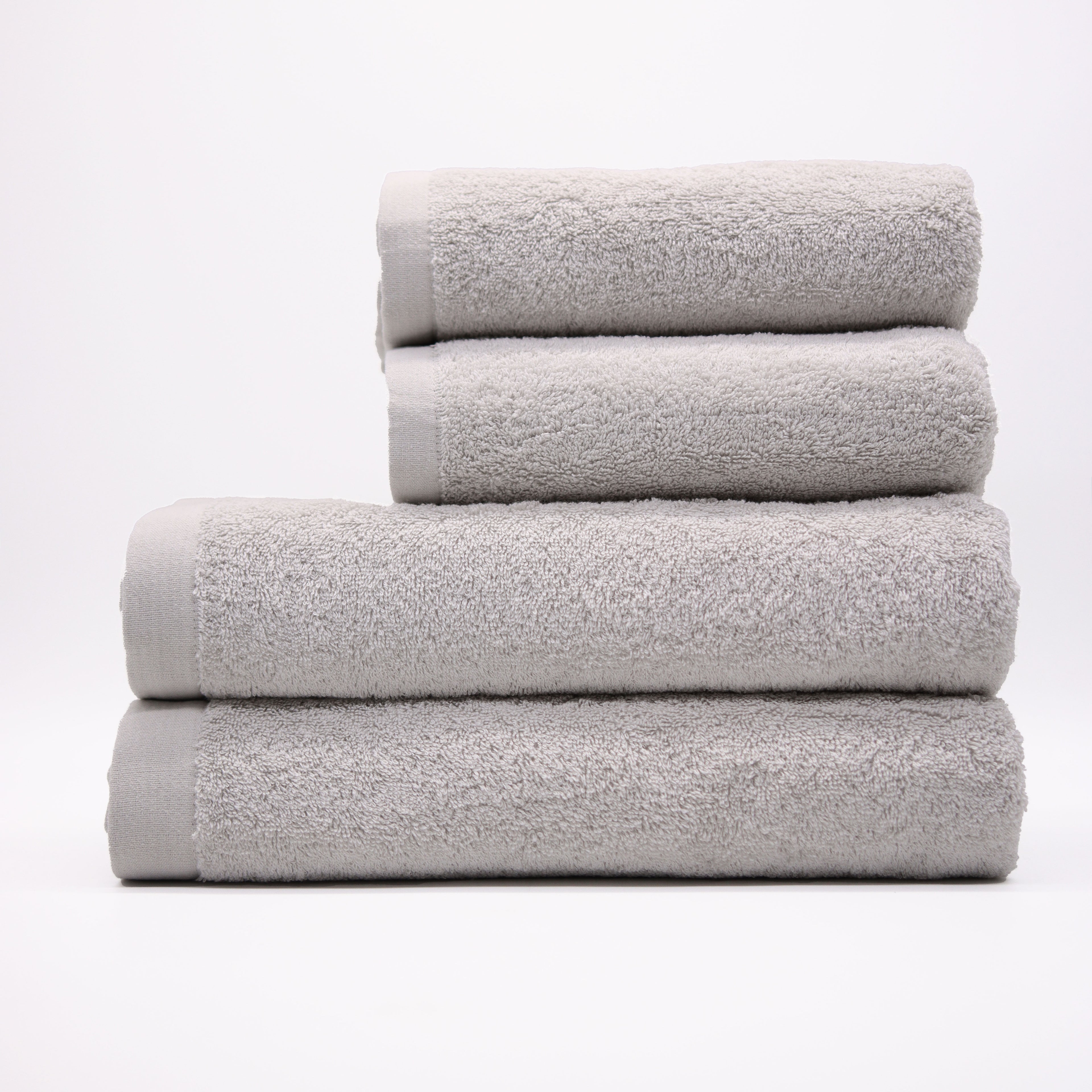 Stack of gray towels on a white background
